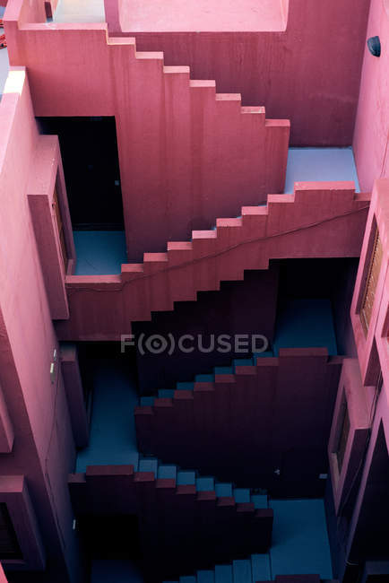 From above traditional construction of pink building with blue stairs — Stock Photo