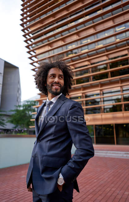 African american businessman standing at street — Stock Photo
