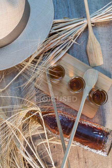 Whiskey shots on wooden table — Stock Photo