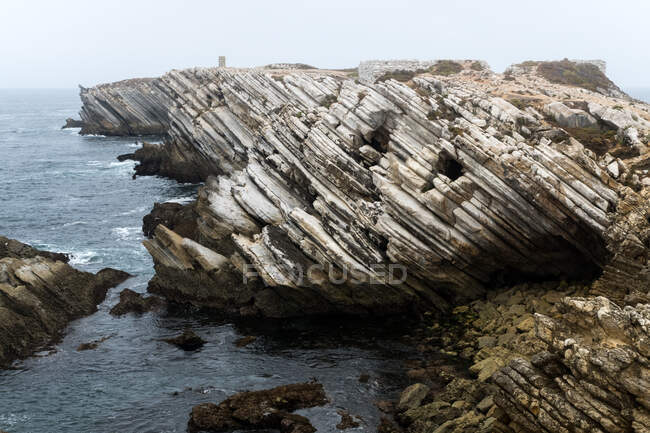 Rocky formations in the island of Baleal on the Atlantic coast in a foggy day. Peniche, Portugal — Stock Photo