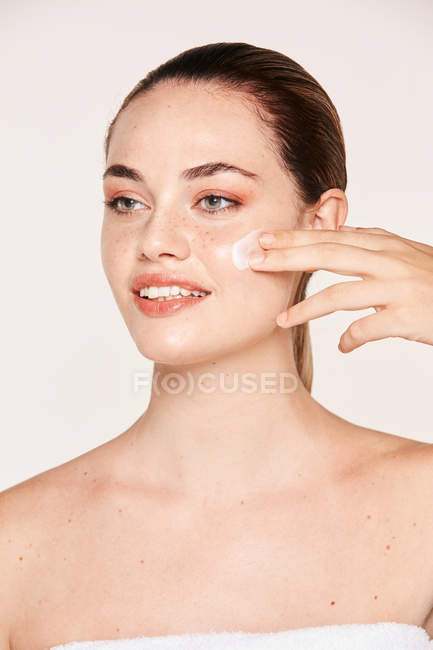 Amiable woman taking care of face — Stock Photo