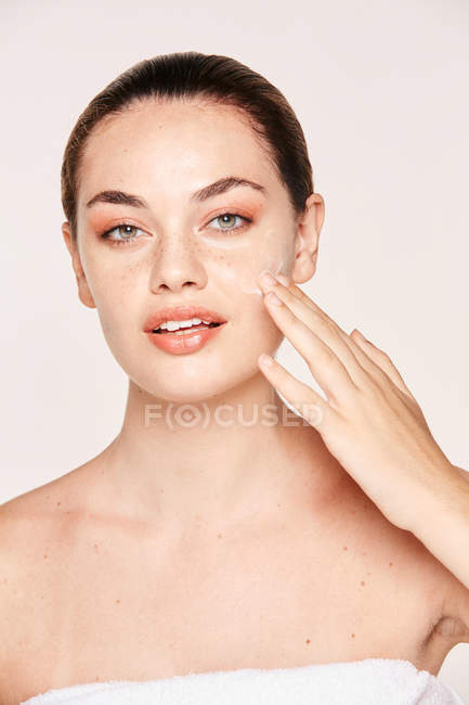 Amiable woman taking care of face — Stock Photo
