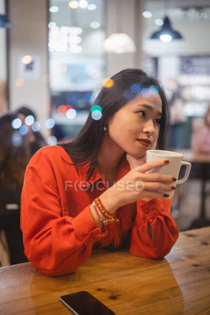 Woman having a cup of coffee — Stock Photo