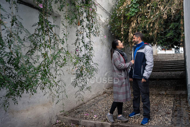Pleased diverse couple exploring ancient town together — Stock Photo