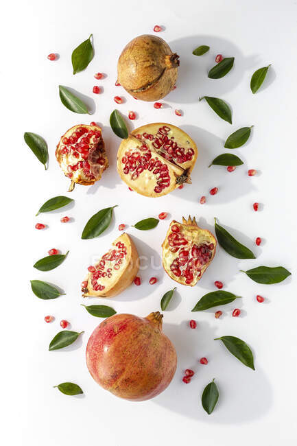 Fresh seasonal pomegranate from above on white background. Healthy food Detox. Flat lay — Stock Photo