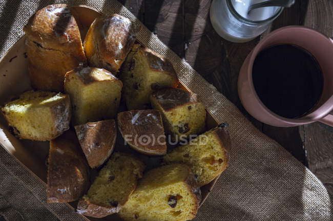 Tray with pieces of homemade panettones on table — Stock Photo