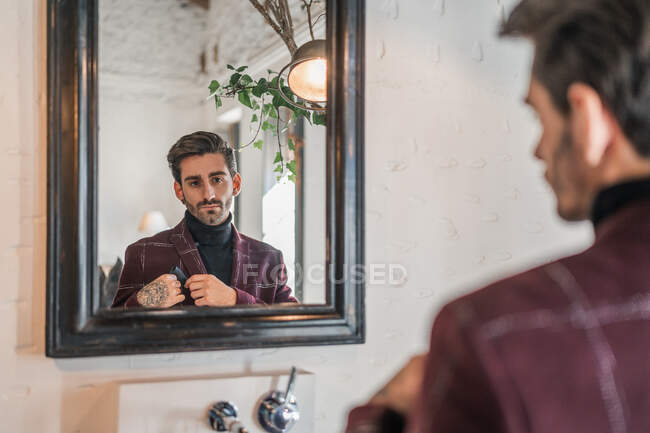 Serious pensive businessman getting ready for event — Stock Photo