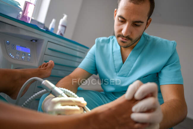 Podiatrist making procedure with patient — Stock Photo