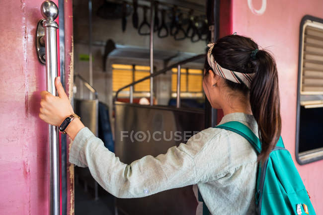 Female tourist having board train — Stock Photo