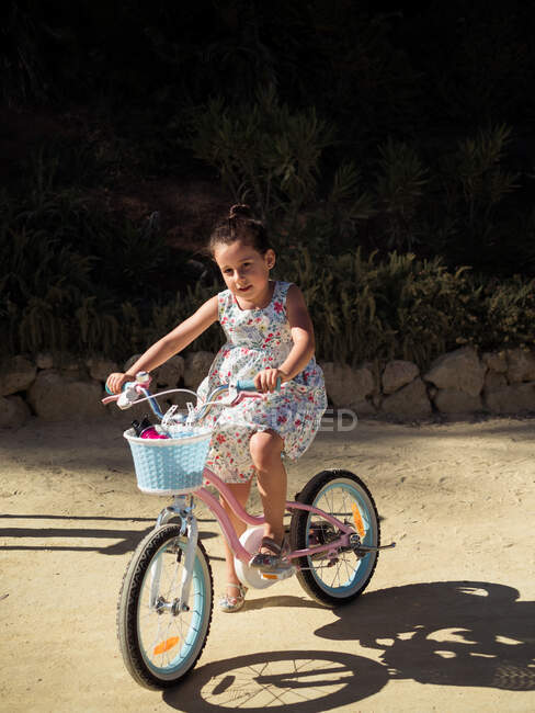 Little girl riding bicycle — Stock Photo