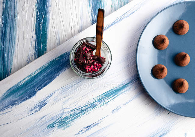 Delicious chocolate sweets on wooden table — Stock Photo
