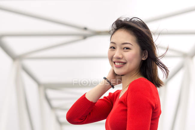 Pleased Asian young woman enjoying walk — Stock Photo