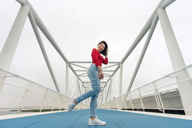 Pleased Asian young woman enjoying walk — Stock Photo