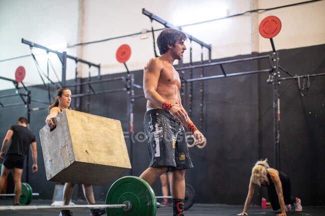 Tired man standing in gym — Stock Photo