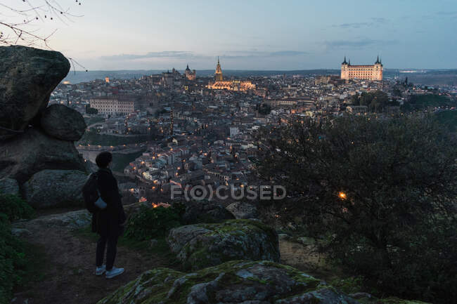Tourist enjoying view of night old city — Stock Photo