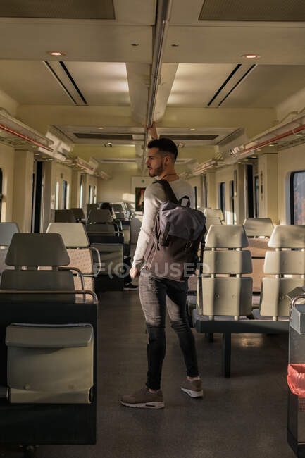 Focused young male passenger riding metro in daytime — Stock Photo