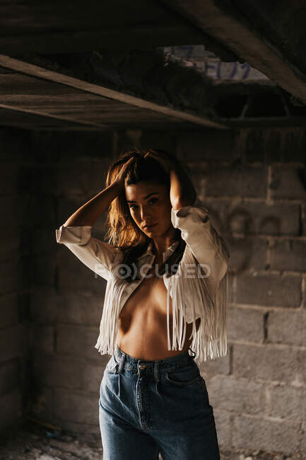 Sensitive young female model inside abandoned building — Stock Photo