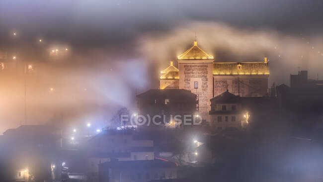 Mysterious landscape of shining and luminous ancient town of Toledo in foggy dusk — Stock Photo