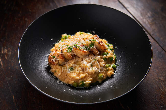 Tasty risotto with shrimps on plate — Stock Photo