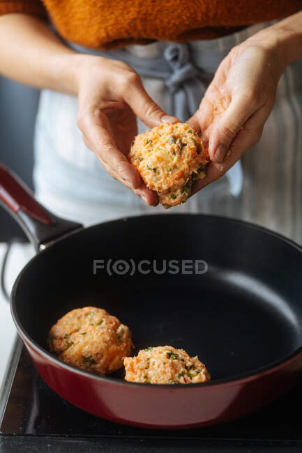 Woman making meatless cutlets at home — Stock Photo