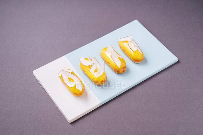 Yummy eclairs with coconut — Stock Photo