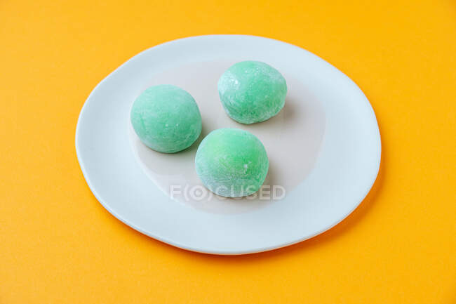 Delicious dessert with green icing — Stock Photo