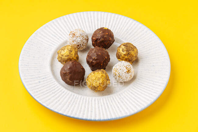 Nut balls with various frosting — Stock Photo