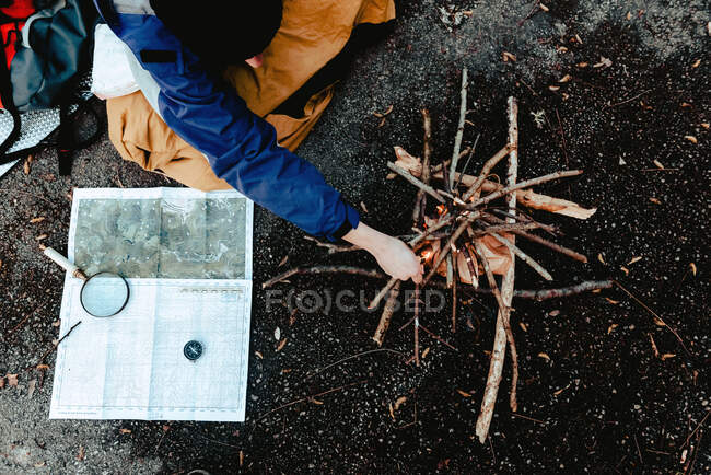 Small bonfire from firewood on ground — Stock Photo