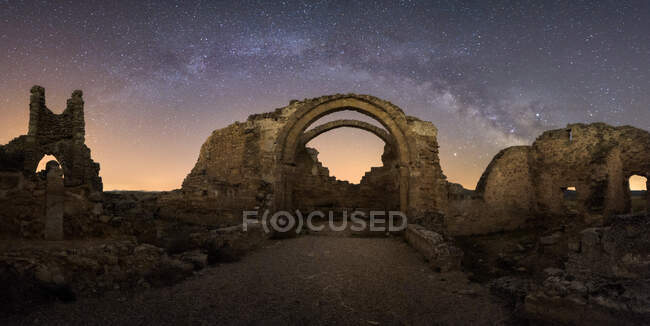 Remains of ancient castle under Milky Way at starry night — Stock Photo