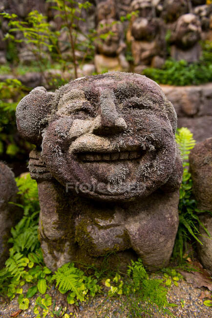 Old stone statues in park — Stock Photo