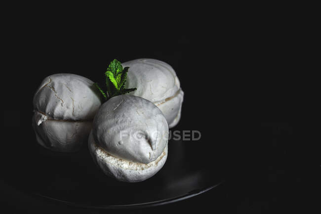 From above homemade white Zefir or Zephyr, Russian traditional dessert with mint on black background — Stock Photo