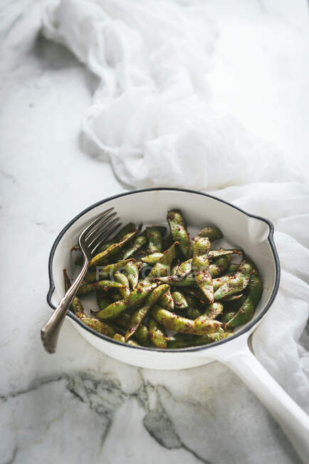 Bowl with edamame dish on table — Stock Photo