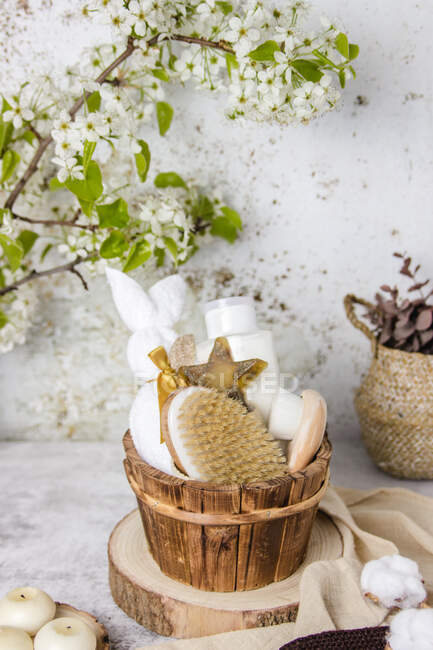 Eco friendly bathroom accessories and natural cosmetic products placed on table with blooming tree branch — Stock Photo