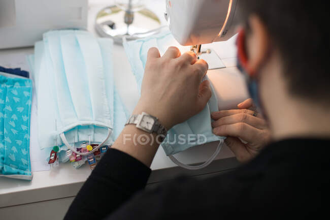 Woman making facemasks for coronavirus pandemic — Stock Photo