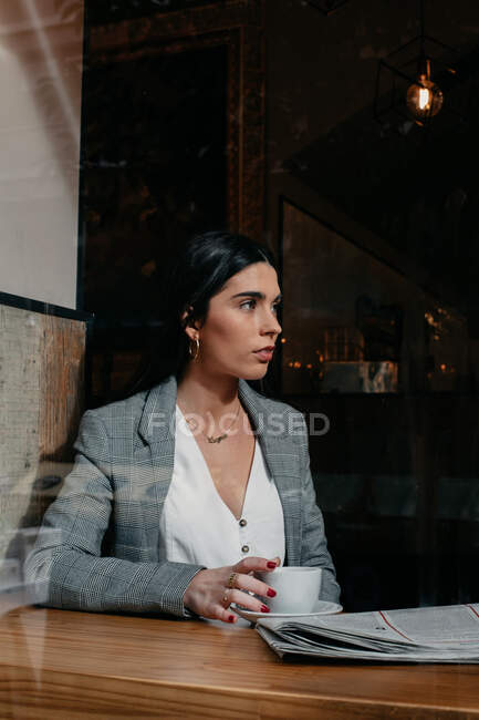 Close-up of a woman behind a window — Stock Photo