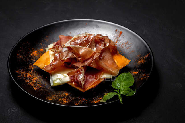 Homemade toasted bread with ham and different types of cheeses on dark background — Stock Photo