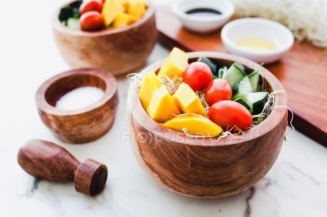 Salad bowls with microgreens and chopped vegetables — Stock Photo