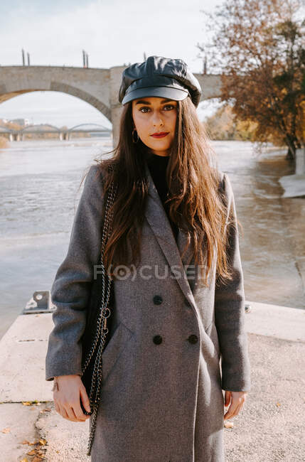 Young woman on embankment — Stock Photo