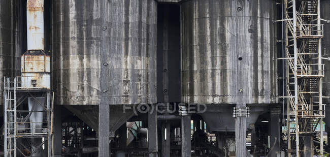 Shabby giant metal cylinder metal deposit frame structure abandoned in coal mine — Stock Photo