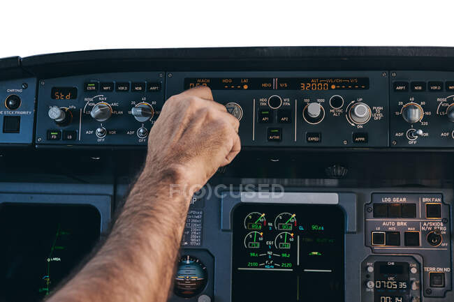 Pilot using flight management system during flight — Stock Photo