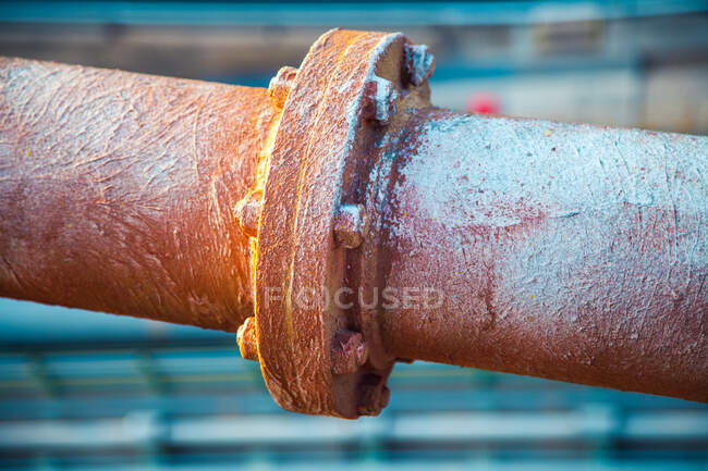 Joint of flanges of pipeline screwed with metal nuts and bolts transporting liquid nitrogen at factory — Stock Photo