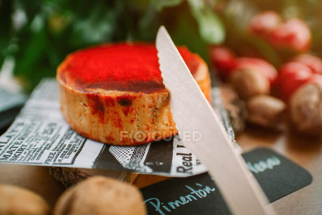 Delicious snack made of pate with seasoning placed with knife on table — Stock Photo