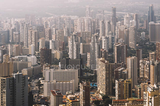From above cityscape of densely built Benidorm city district with contemporary skyscrapers covered with haze in Spain — Stock Photo