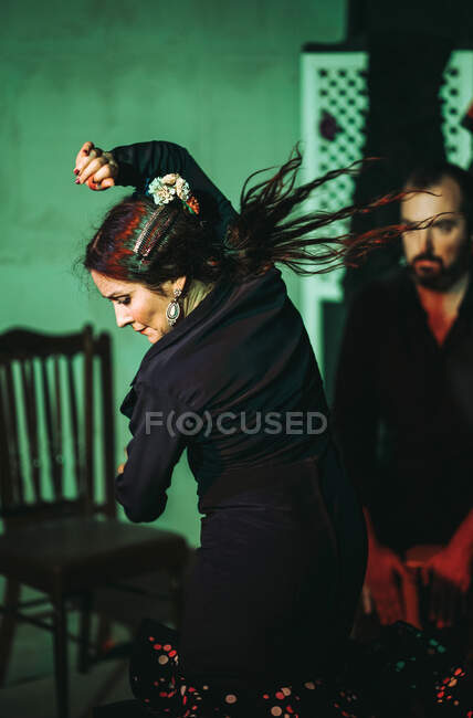 Hispanic female flamenco dancer acting on theater stage — Stock Photo