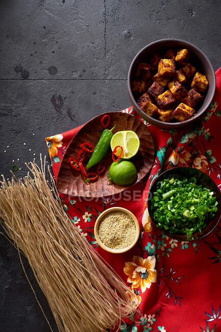 Ingredients for cooking vegetarian ramen with tofu laid on the dark background — Stock Photo