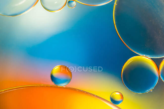 Closeup of abstract background with round shaped cells of vaccine of  different sizes illuminated by colorful light — aid, copy space - Stock  Photo | #451335900