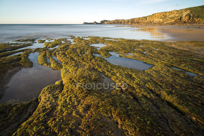 Liencres beach at sunset in a dreamy landscape in Cantabria, North of Spain. — Stock Photo
