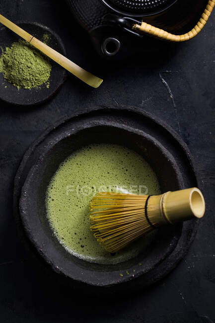 From above of traditional Japanese matcha with tea whisk in stone bowl for traditional oriental ceremony — Stock Photo
