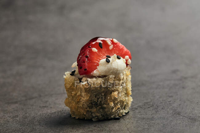 High angle of fried roll of Japanese sushi roll with sesame and strawberry slice — Stock Photo