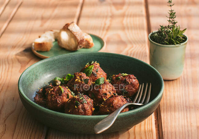 Closeup of a plate of meatloaf with some parsley — Stock Photo